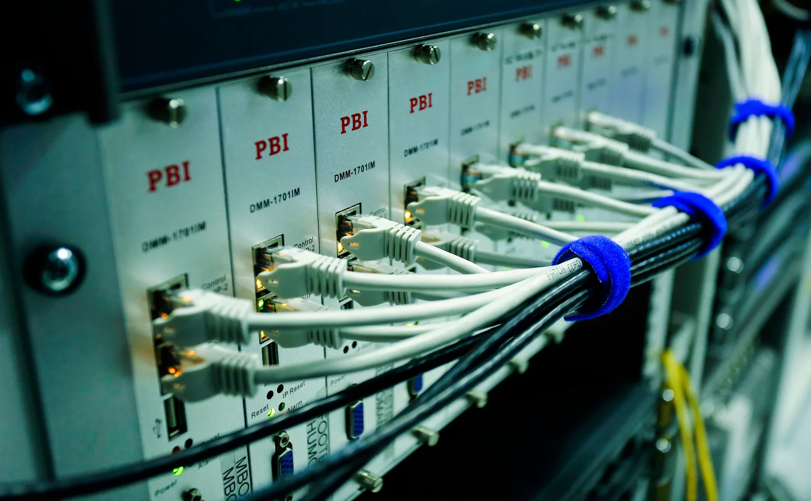 Close-up of ethernet cables connected to a network switch panel in a data center. The martech stack management trends that will still matter next year