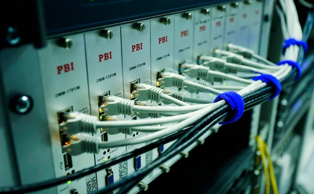 Close-up of ethernet cables connected to a network switch panel in a data center. The martech stack management trends that will still matter next year